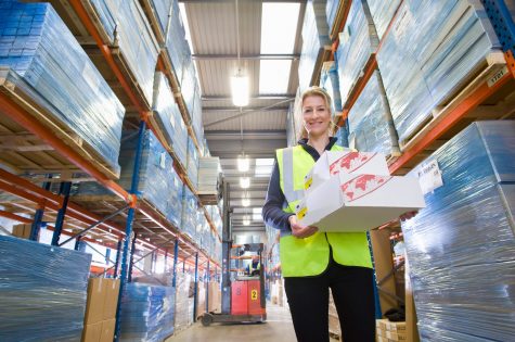 a-low-angle-shot-of-a-smiling-female-warehouse-wor-2025-10-15-05-03-42-utc